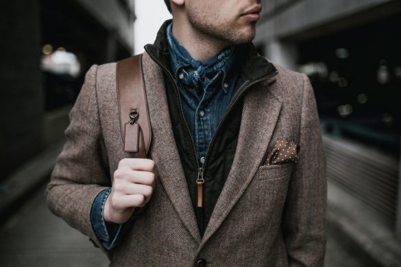 Attractive guy wearing a brown coat